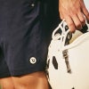 vuori shorts and a football helmet