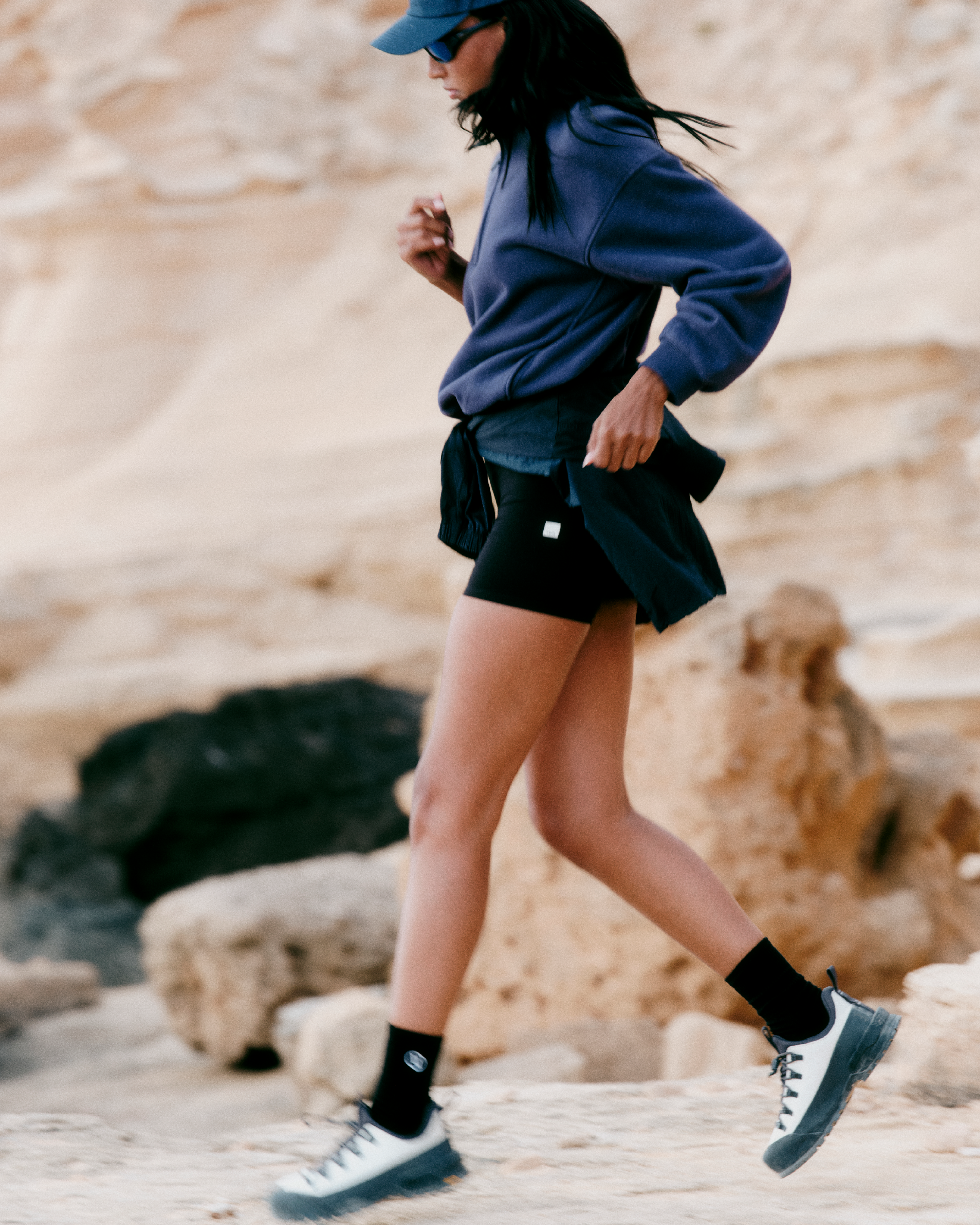 woman wearing vuori running outdoors