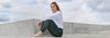 woman wearing performance jogger and halo essential hoodie