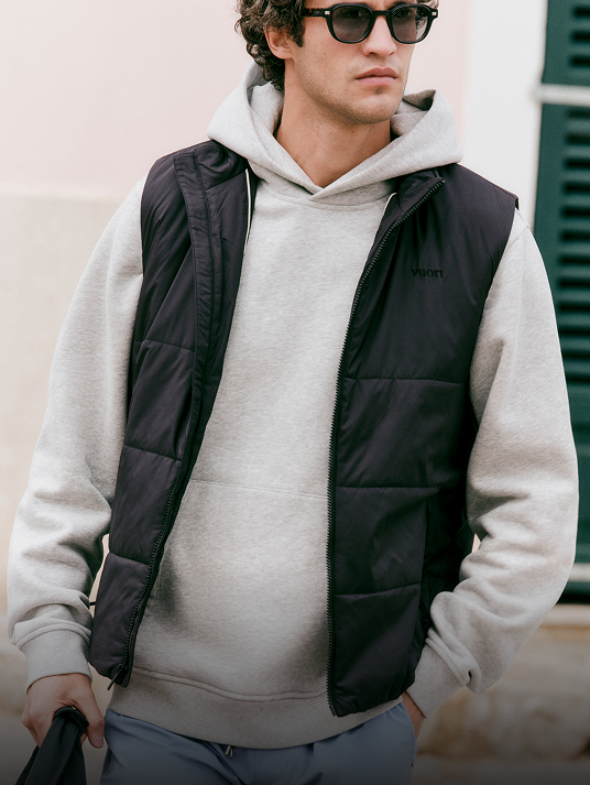 man wearing vuori hoodie