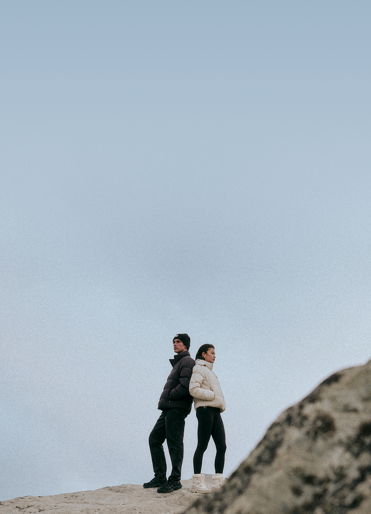 man and woman wearing vuori outerwear