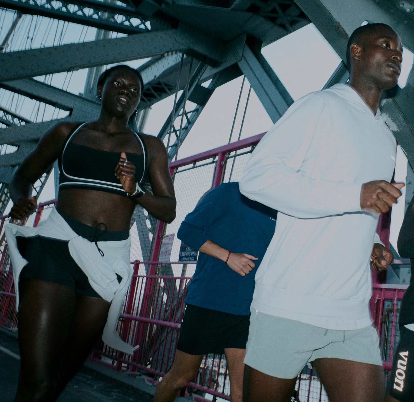 man and woman running in vuori clothing