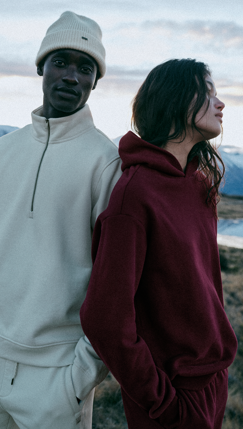 man and woman wearing vuori fleece