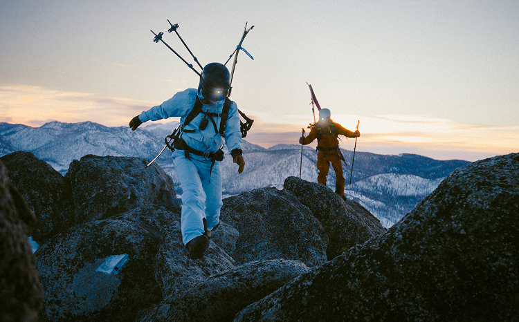 man and woman wearing vuori snow