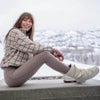 woman wearing the vuori cozy sherpa windowpane