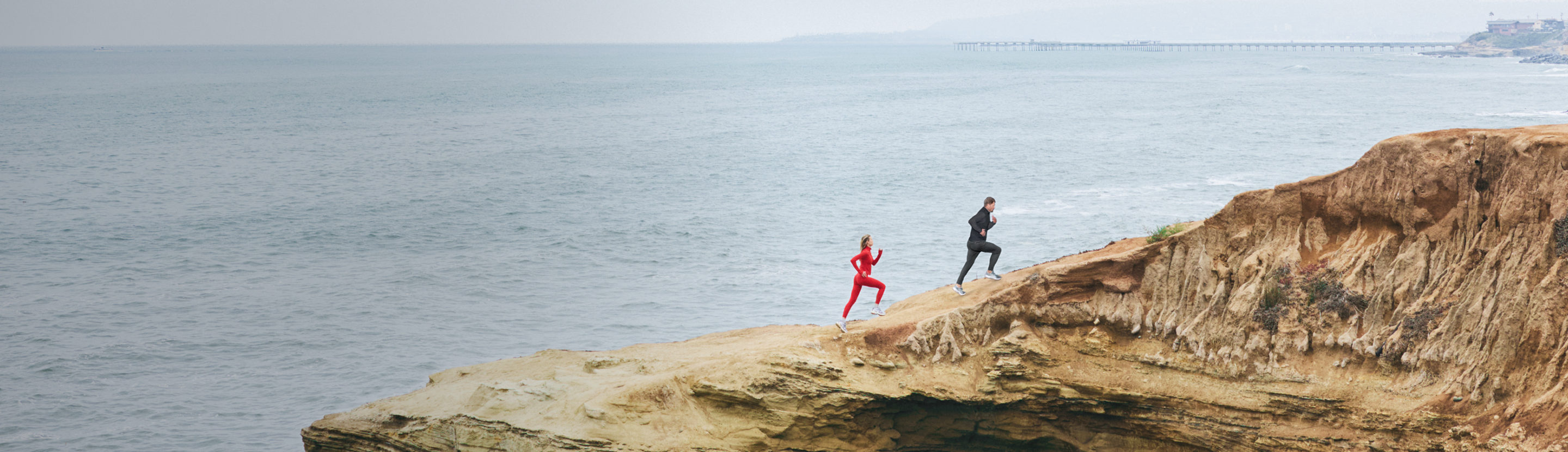 man and woman hiking in vuori clothing