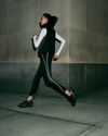 woman running wearing vuori