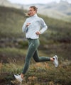 woman wearing spectra run jacket and daily legging