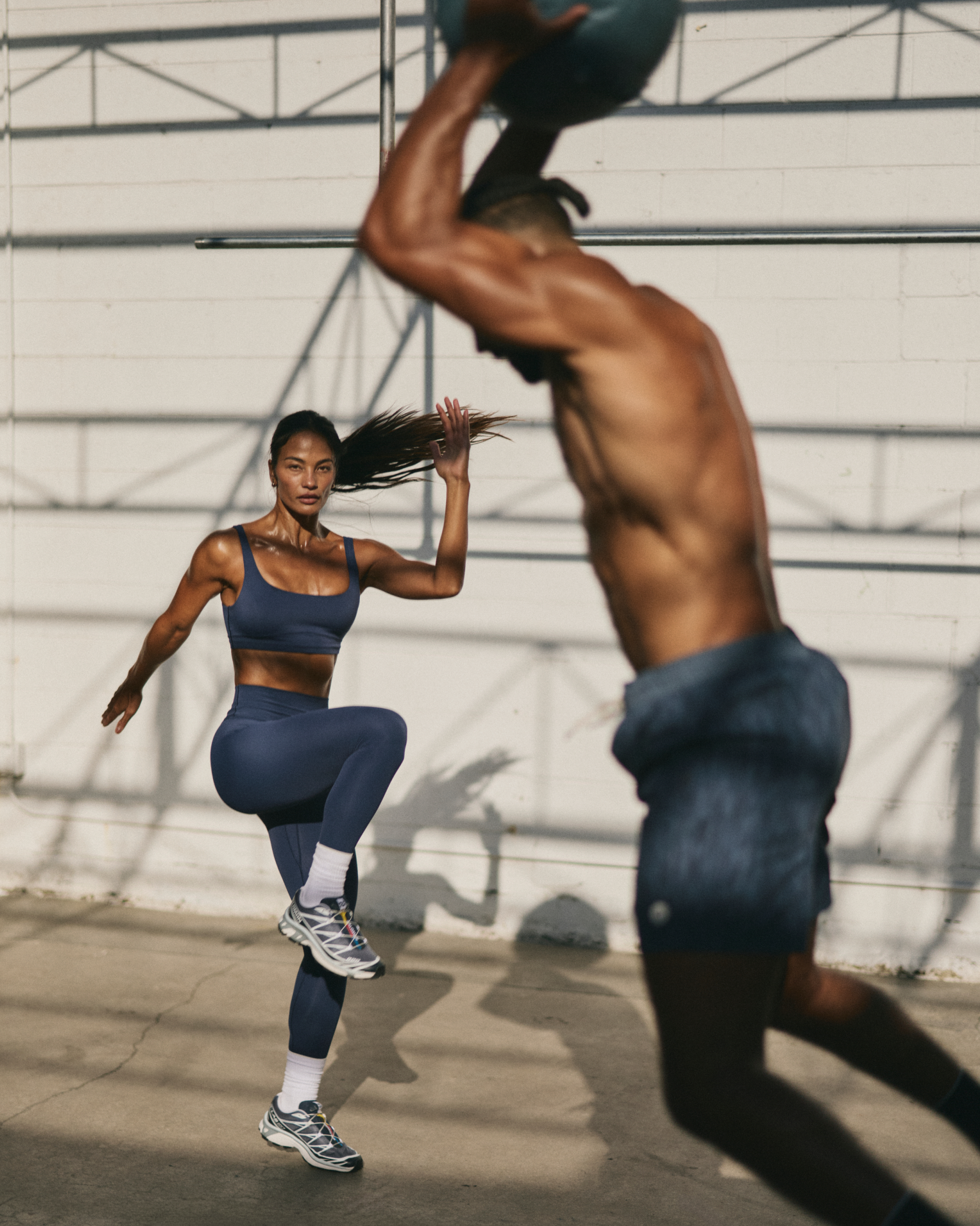 woman and man wearing vuori and working out