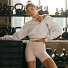 woman wearing restore 1/2 zip
