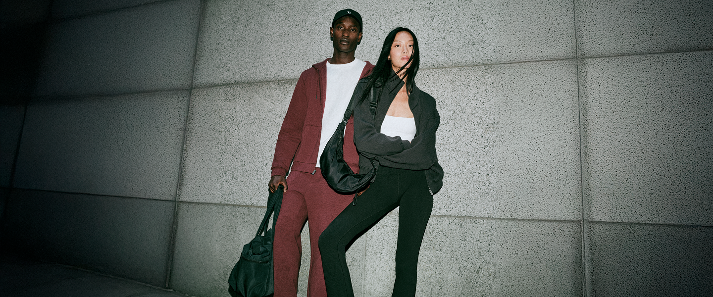 man and woman wearing vuori