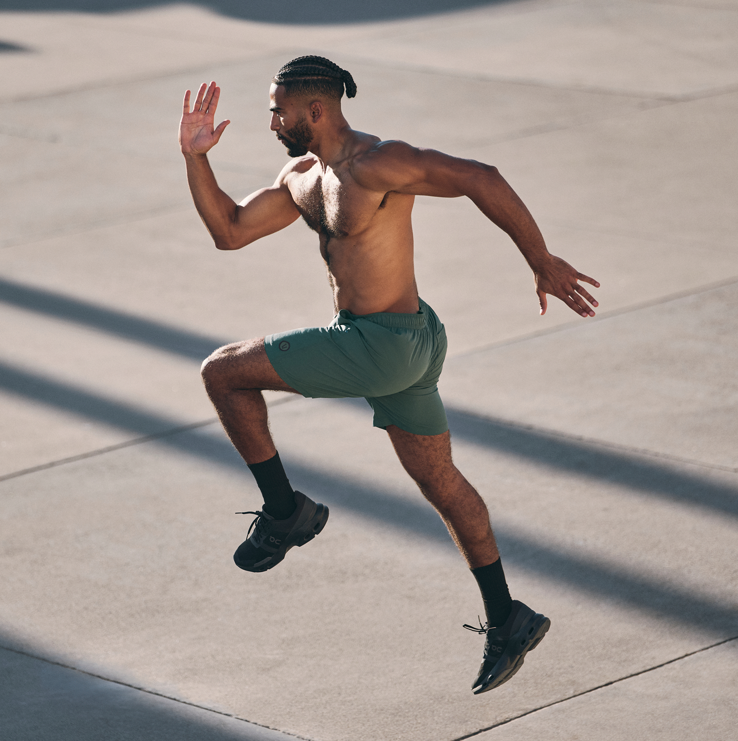 man wearing kore short in agate green