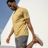 man stretching in the breathable tee