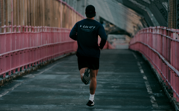 man running in vuori clothing