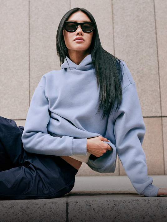 woman wearing the restore hoodie