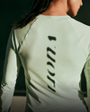 woman wearing vuori long sleeve in lemongrass