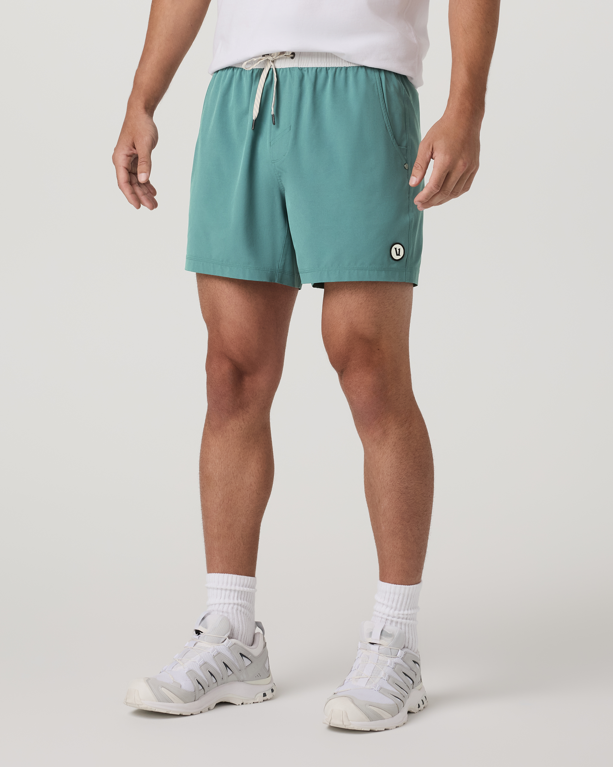 man wearing kore unlined short in bluegrass