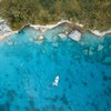 aerial photo of a boat on the coast of the bahamas