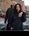 man and woman wearing vuori in black