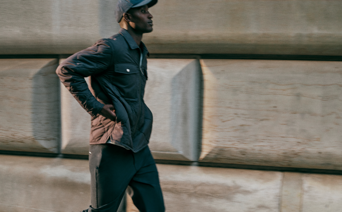 man wearing vuori echo insulated collection