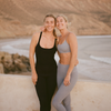 two women wearing vuori on moroccan beach