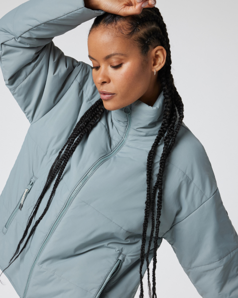 woman wearing canyon insulated jacket in vintage pistachio