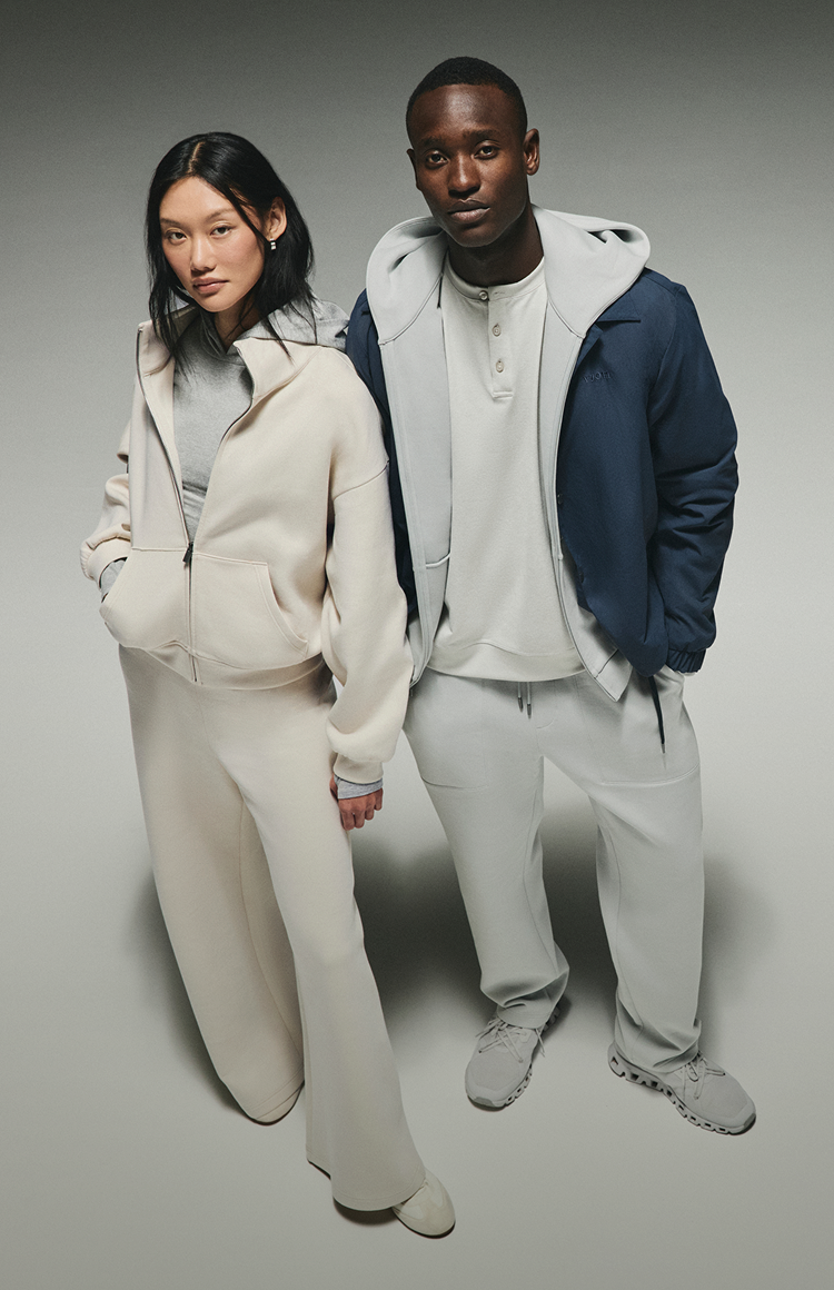 man and woman wearing vuori 