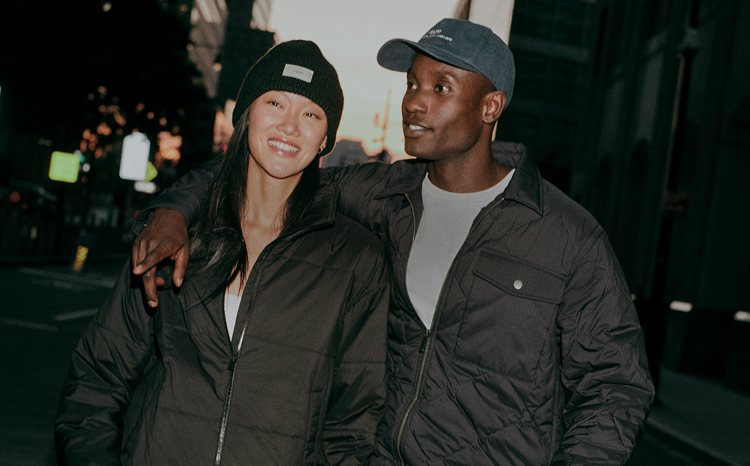 man and woman wearing vuori accessories