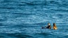 Woman and man in ocean