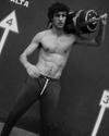 man wearing vuori lifting weighted bag