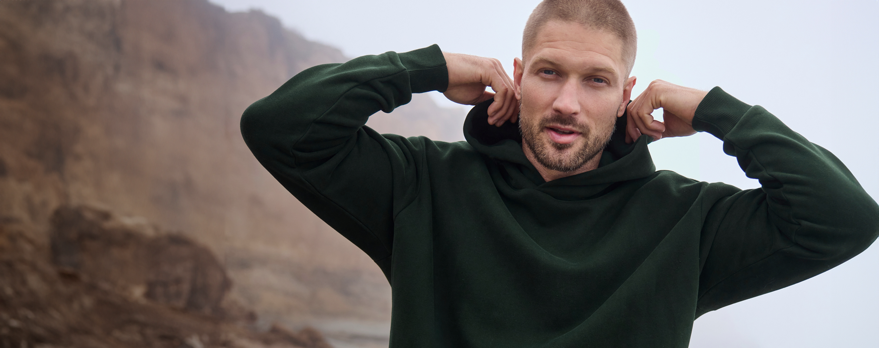 man wearing vuori restore hoodie