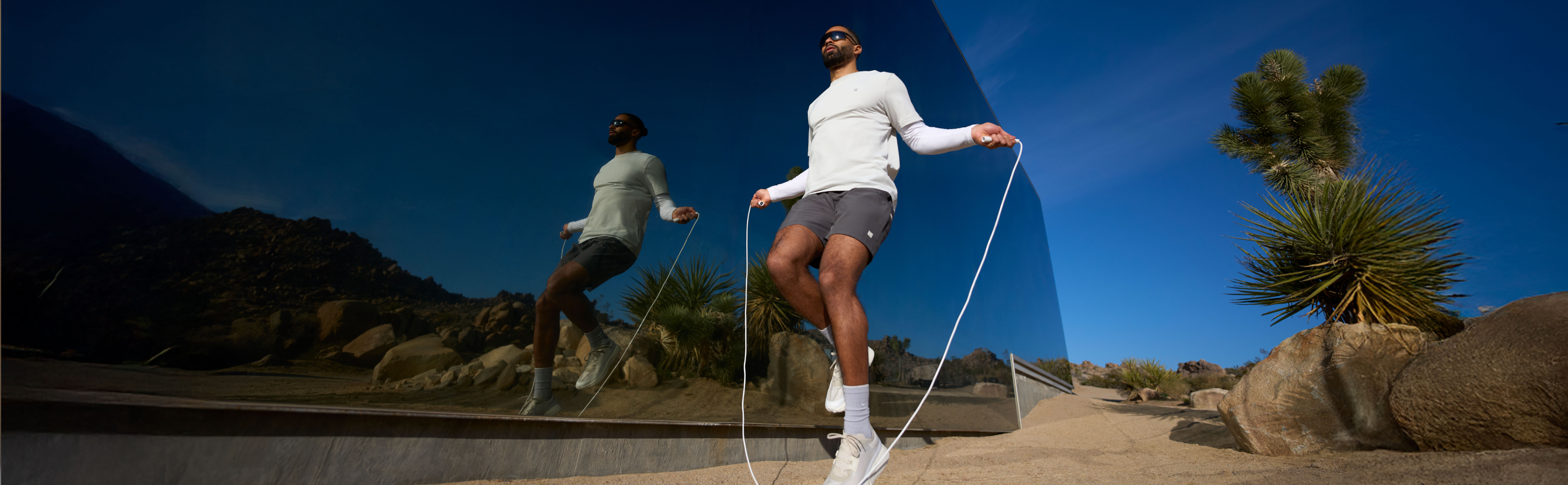 man jump roping in vuori clothing