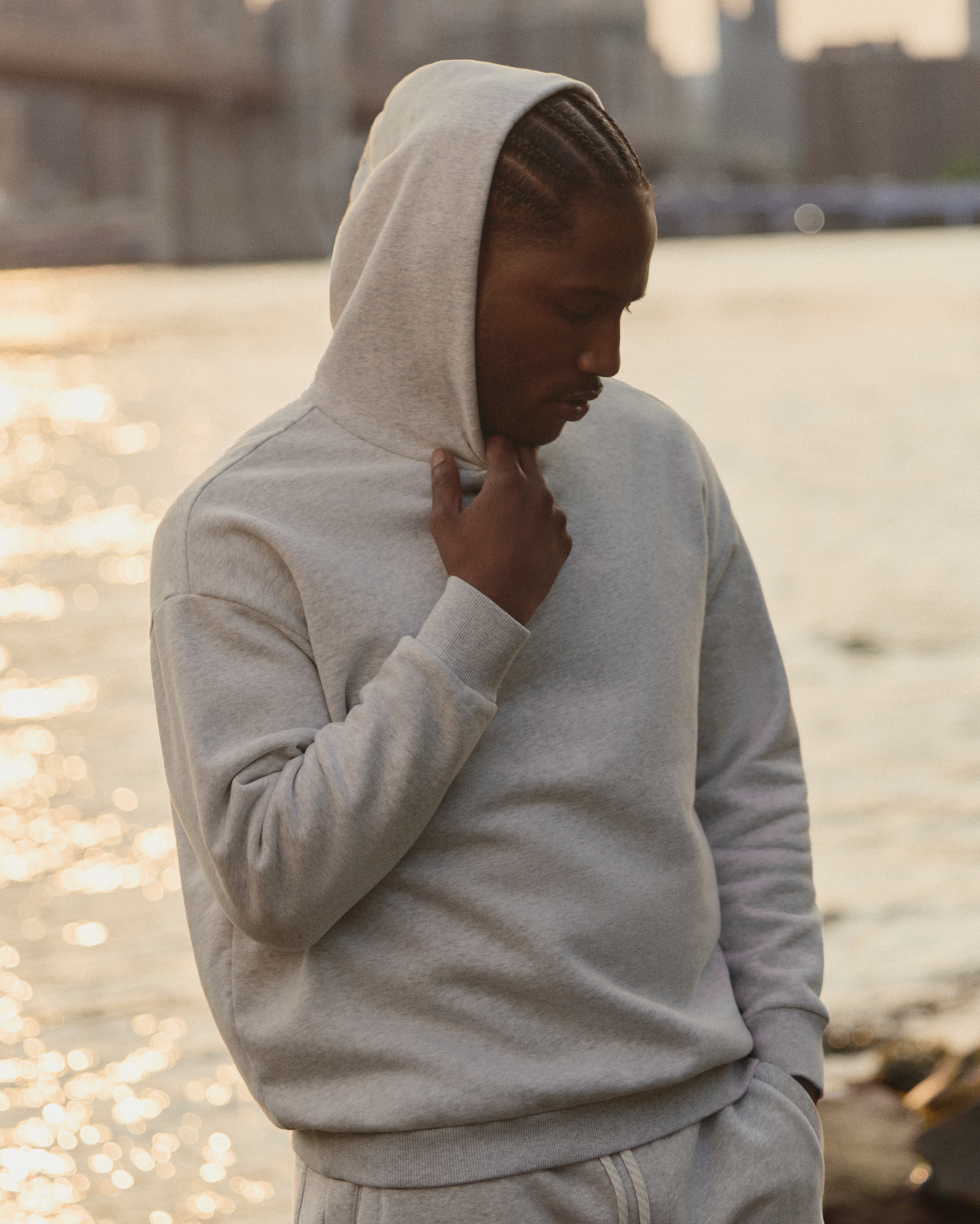 man wearing a vuori restore hoodie