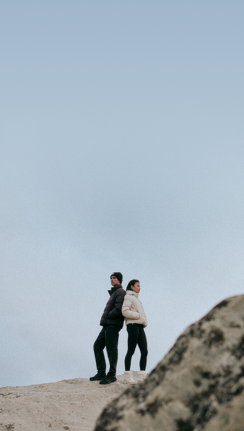 man and woman wearing vuori outerwear