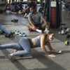 woman using a foam roller for recovery with Exos