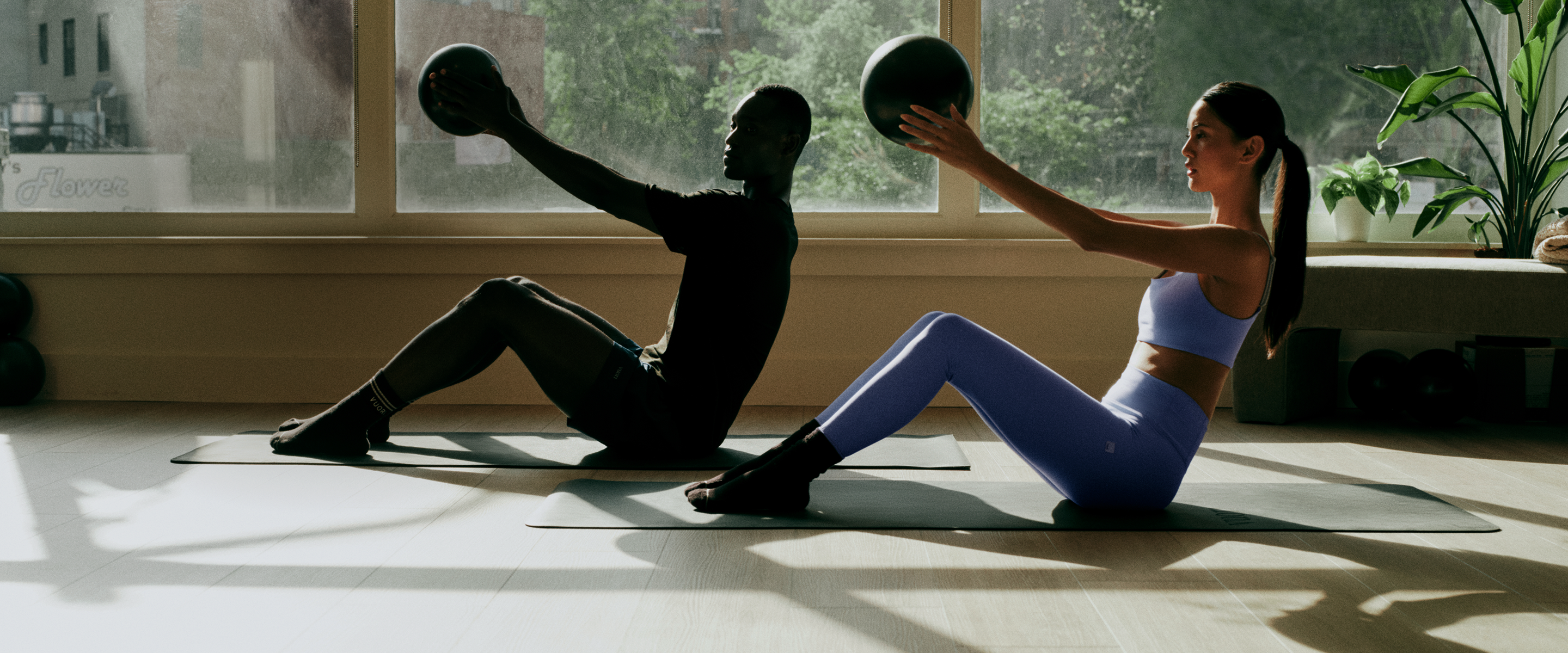 man and woman wearing vuori clothing