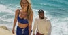 man and woman positioned to run wearing vuori on a track