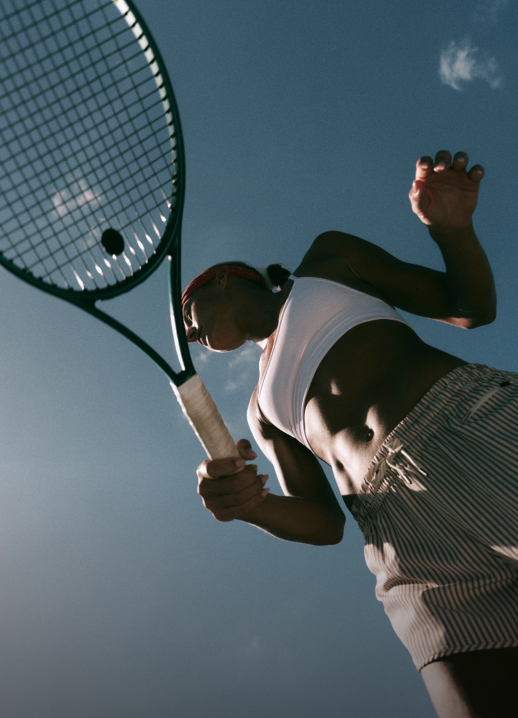 woman playing tennis in vuori clothing