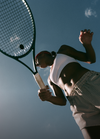 woman playing tennis in vuori clothing