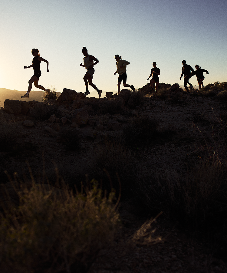 group of men and woman running outside