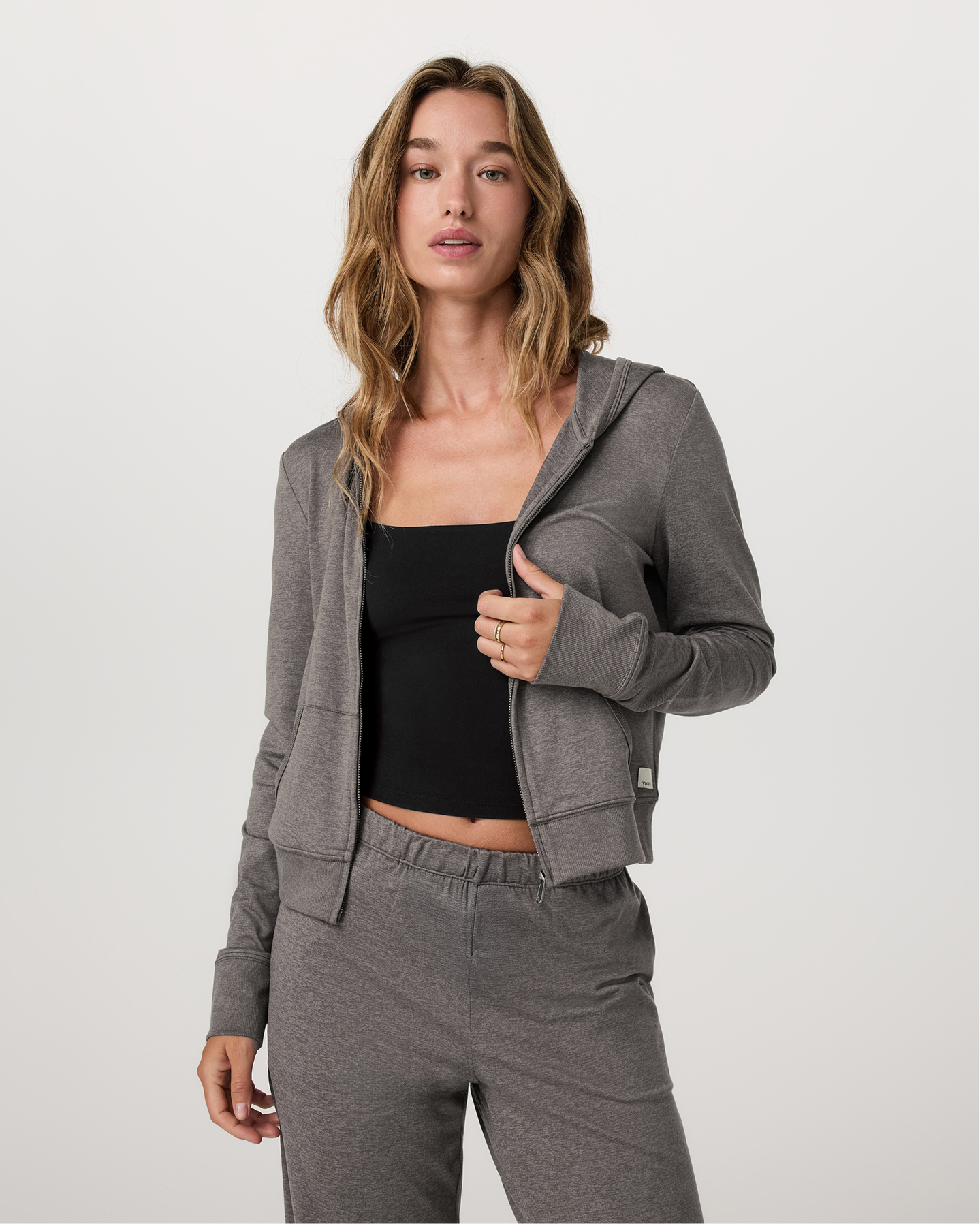 Model wearing the Vuori Halo Mini Full Zip Hoodie