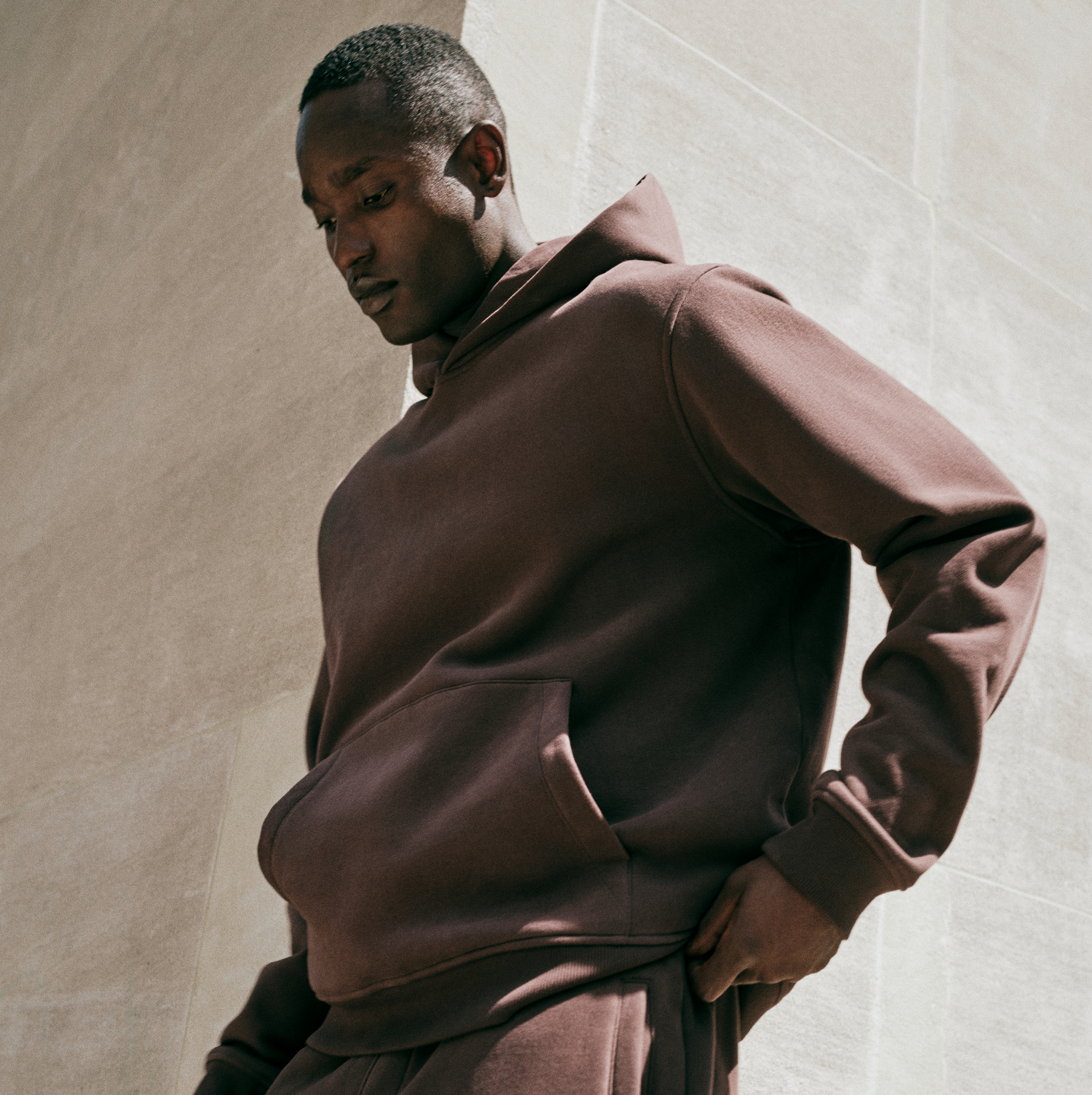 man wearing vuori hoodie