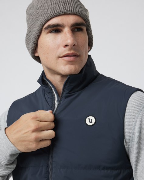 man wearing Echo Insulated Vest 2.0 in Navy