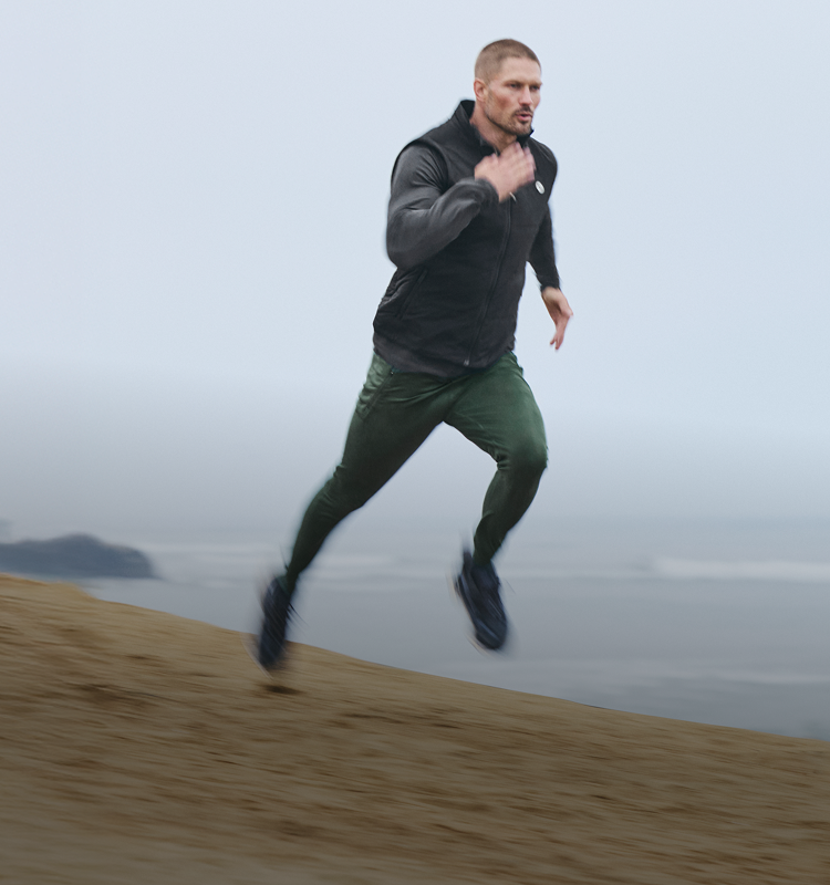 man running in vuori active wear