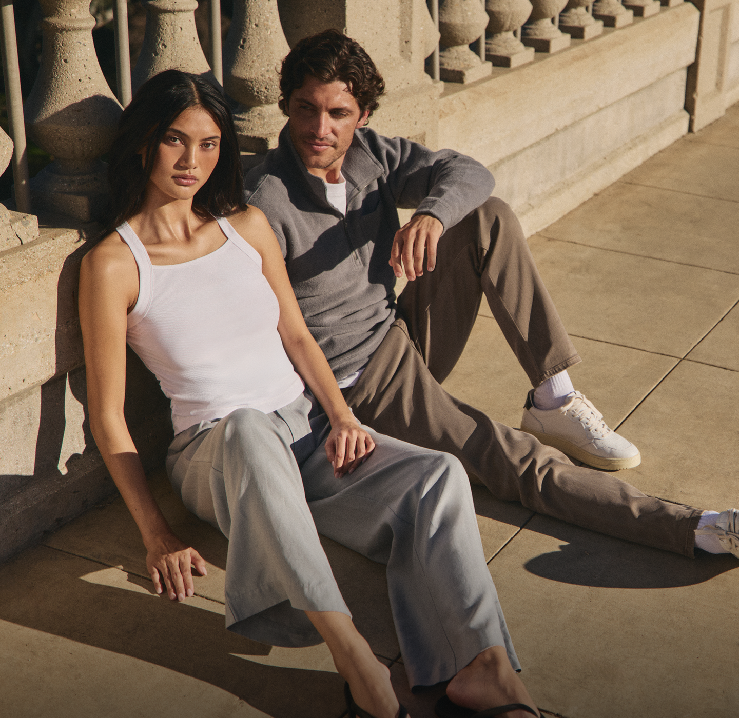 man and woman wearing vuori clothing for travel