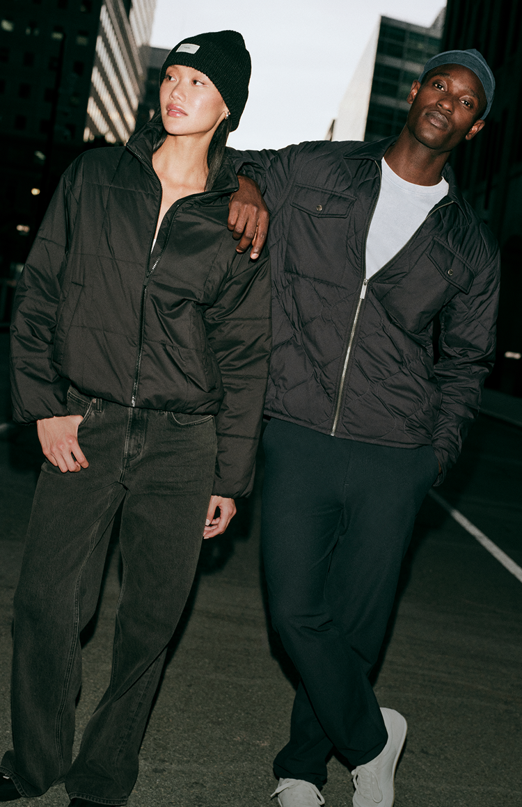 man and woman wearing vuori