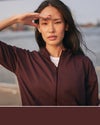 woman wearing vuori in raisin