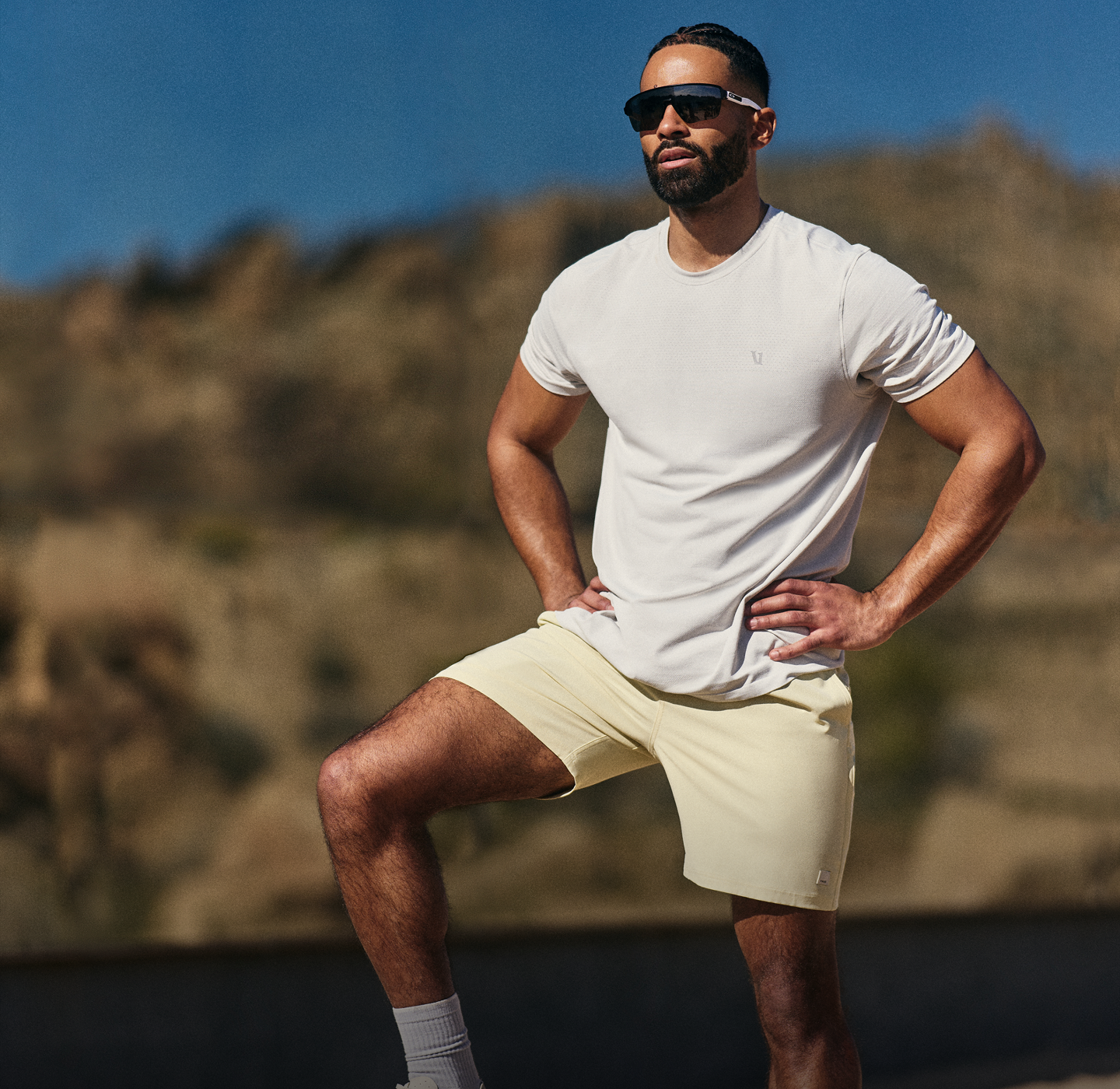 man wearing vuori banks session short in seed