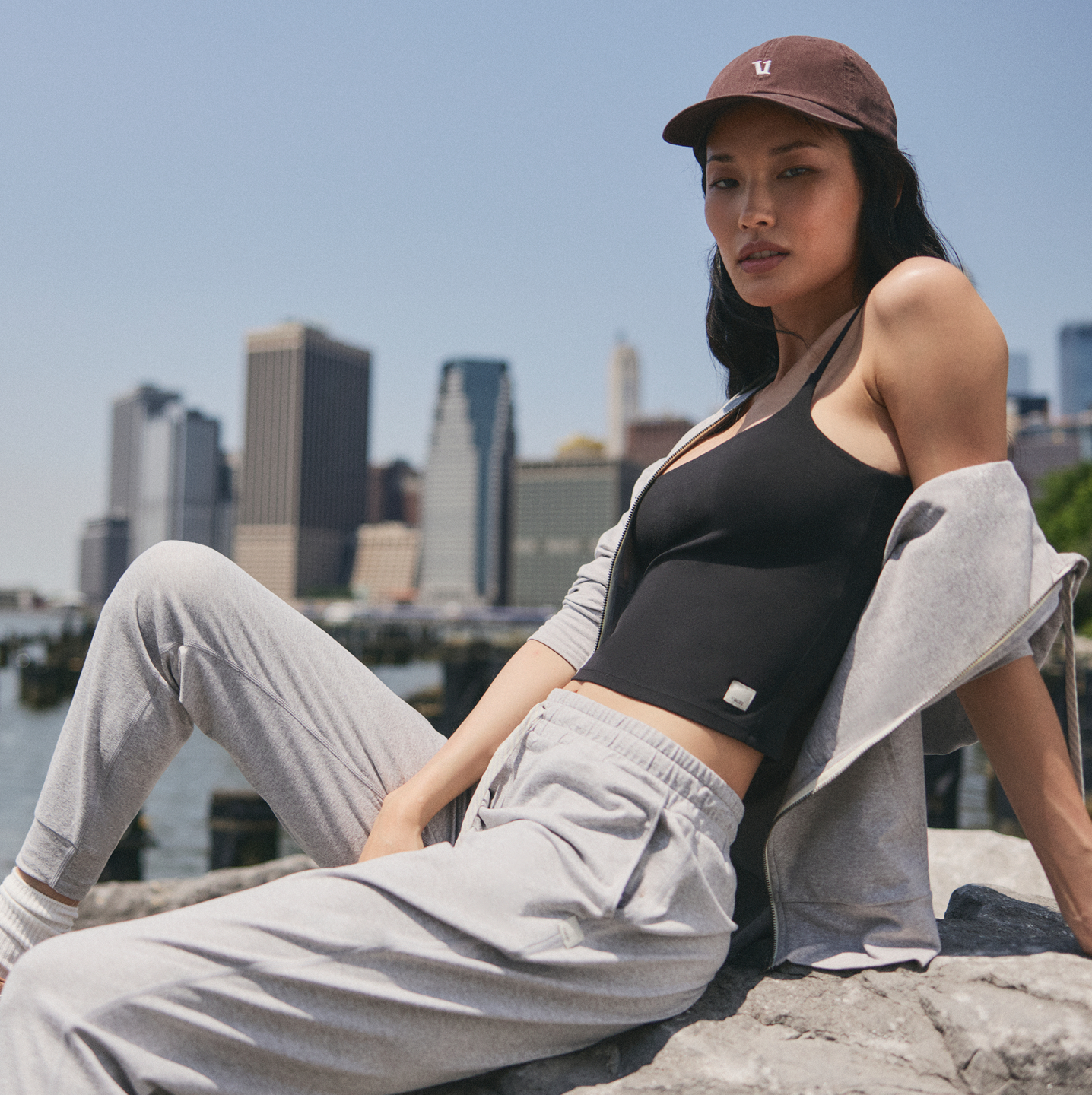 woman wearing vuori and lounging in the city