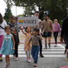 children marching with a handmade vuori sign